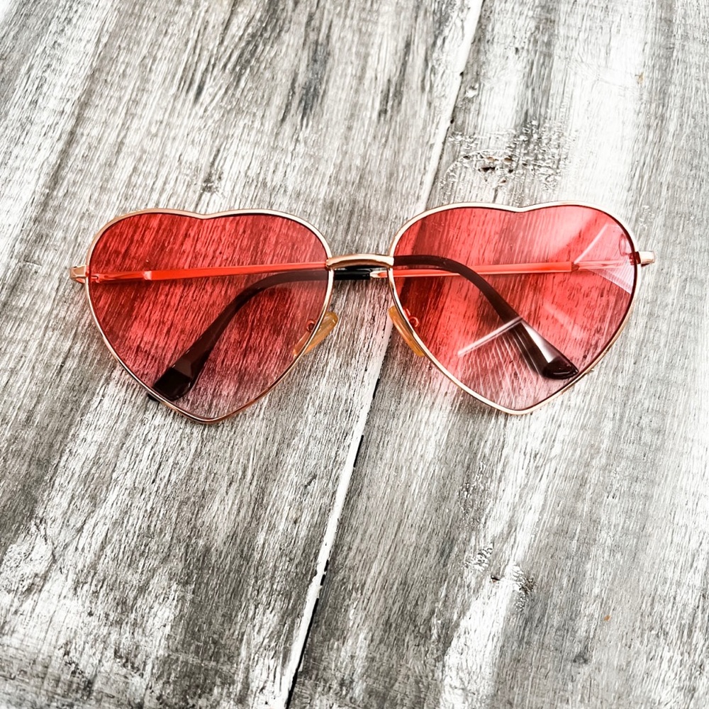 Rose colored Heart shaped glasses.